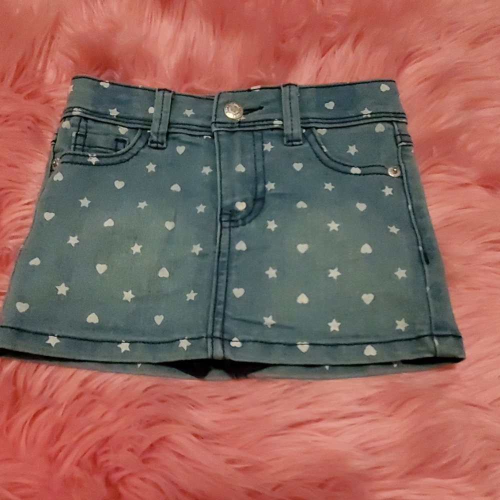 Denim skort with hearts and stars.